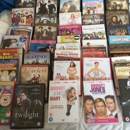 Lots of dvds and cds (some dvds are sealed) Cartier bag full of dvds and over 20 cds