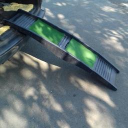 Heavy duty dog ramp with none slip mats folds up with a handle for easy storage