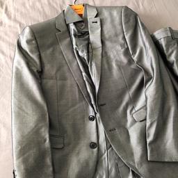 Brand new men’s suit 
With trousers size 38
Silver shirt M size 
Coat 40. S slim fit
