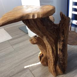 Solid table made from tree trunk and slices . Can be used every in or outside  
Very little use as been in spare bedroom
