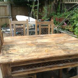 Solid wood table and 4 chairs with cast iron inserts

NEEDS LIGHT RESTORATION as been stored under cover
Quite heavy so may need 2 people to move
Pick up skelmersdale
