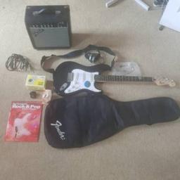 As new condition 
Come with Guitar, black case, digital guitar tuner, amp, pedal, learning book, fender head phones, ect 

Brilliant Christmas present and a starter pack for someone starting out. 

Only used a handful of time.