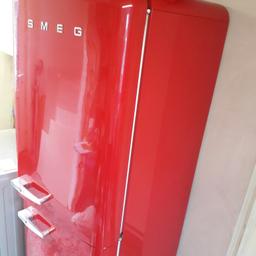 Red Smeg 50s Retro Fridge Freezer.

Fab 32 range. Model FAB 32X1.

In working order, but used condition.

600mm wide, 1790mm high & 660mm deep (including the door).

Few small defects:
In the freezer, the corner of the plastic front of one of the drawers is cracked off.
In the fridge, the metal bar for one of the small inner door plastic shelves is missing. One of the corner supports for the top shelf is missing. Small 2mm chip to front door.

Spare parts are available online.

Collection only.