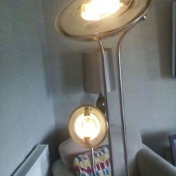 Tall metal lamp.halogen bulbs all works as it should.few marks good condition.