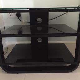Modern black TV stand from John Lewis, holds up to a 40 inch TV. My tv is now on the wall so no longer needed. Cost £45 new just over a year ago, no offers please