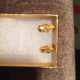 Pair of 22ct real gold ladies stud earrings, selling for £40 cheaper than bought. Screw back studs more secure to wear, solid.