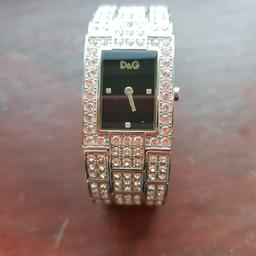 Stunning watch with Swarovski crystal band. This watch glitters so much when worn. I have extra links in case the band is too tight. This item is much loved. I'm sad to have to sell.