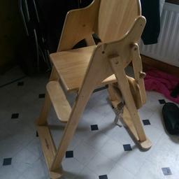 Wooden high chair, with safety straps, table fold s back,so ugh chair can go up to a dinning table