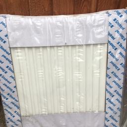 Small white radiator new in packet.