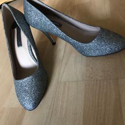 Selling a brand new pair of Dorothy Perkins heels in size 5. They are silver sparkly. The label calls them Pewter. Lovely for a wedding / party season. They aren’t in the box but still have labels on etc. Collection or can post for additional £3.95 second class.
