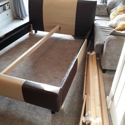 KING SIZE CREAM/BROWN LEATHER BED FRAME including all lats. slight burn on foot end of bed cannot be seen when bedding is on. Collection only