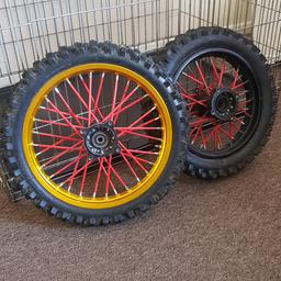 SDG Pitbike wheels with red spoke protectors . 14inch front and 12 rear. In really good condition all round. Comes with bearings.   45 pounds for the pair . Can deliver locally. Check my other pitbike bits for sale