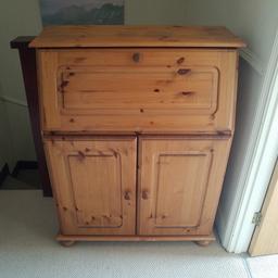 Solid pine writing bureau with cupboard under.  In need of a little TLC.  Some sunlight damage to top as shown.