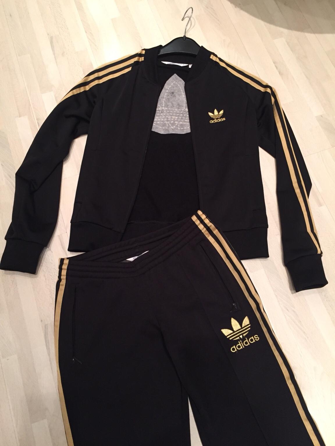 Adidas sportanzug damen store schwarz gold