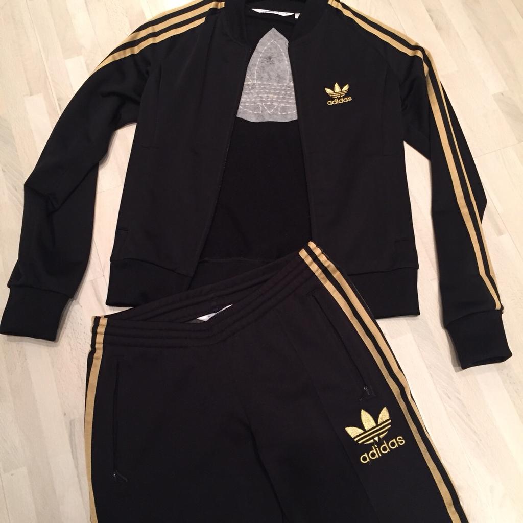 Adidas trainingsanzug shop damen schwarz gold