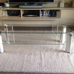 Glass coffee table with silver legs