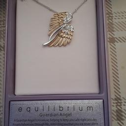 Equilbrium guardian angel necklace. Never worn. Unwanted gift.