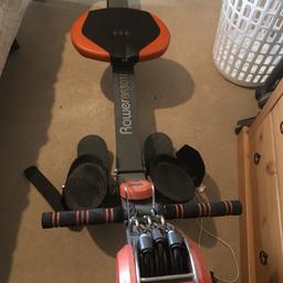 Exercise rowing machine with resistance. Rods and digital timer