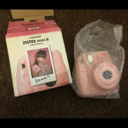Pink instant camera. Practically new never used. No film or strap included. Comes with full instruction and original box. Originally worth £90