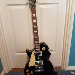 Left Hand Godman guitar complete with Amp Leads and carrying case.