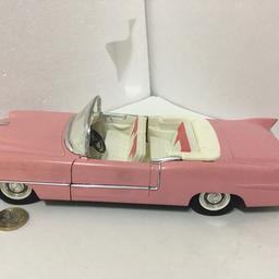 Solido 1:18 size 1955 Cadillac eldorado convertible pink with opening doors, tilting seats and turning front wheels through steering.

Postage available for £3