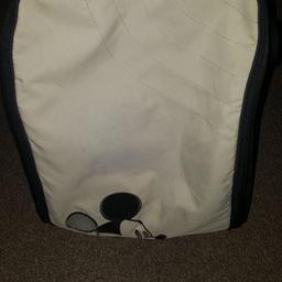 black and cream with mickey mouse on the front. has a shoulder strap and buttons convert it to be strapped onto pram handles. nets and elastics inside to hold bottles/accessories. one zip is missing a rubber gripper but is still working. free to collector.