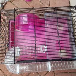 Ideal hamster starter kit including cage, wheel, tunnel, water bottle, food bowl, bedding and nearly full food packet.