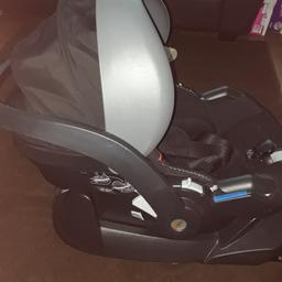 car seat with baby insert, iso fix base also comes with raincover for car seat and pram adapters