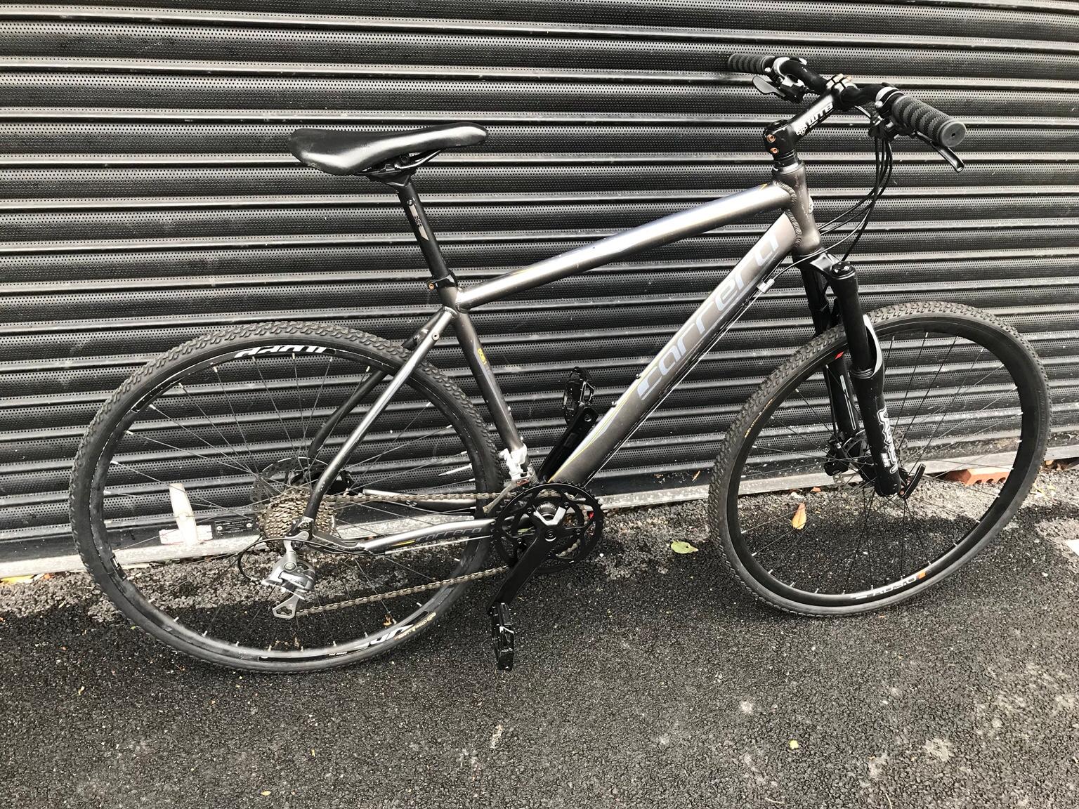carrera gryphon hybrid bike