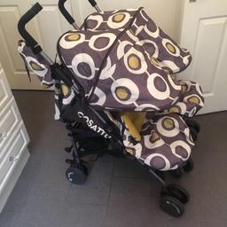 Cosatto double pram used but in really good condition. Very clean. 
Narrow enough to fit through a single door.
Comes with matchin foot muffs and head rests. 
No rain covers however hood expands. 
Viewing welcome.
Any questions please ask.