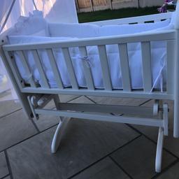 Beautiful crib comes with full bumper and blanket two mattresses a bundle of white sheets if wanted.

Can rock or can lock so doesn’t rock