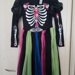 Girls 9-10 year Day of the Dead costume. Only used once . Excellent condition. Comes with headband.