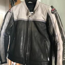 Ladies motorcycle jacket large fits 12/14 stitching at bottom of zip needs a bit of attention but otherwise in good condition shoulder and elbow armour.