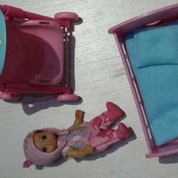 with bed and pushchair. good condition. cute doll