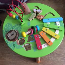 All wooden activity table. Also Has the shapes to push through.