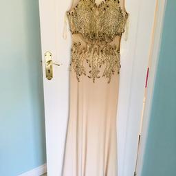 My wife has received as gift, however it is unworn dress purchased from Dubai.

Size 44.

Cash on inspection + collection only