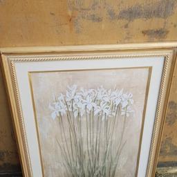 Decorative photo of white flowers and wooden picture frame