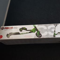 brand new in box flicker c3 green 3 wheeler scooter age 7 plus box has a little bit of damage but doesn't affect use  unwanted Xmas gift last year rrp £120
