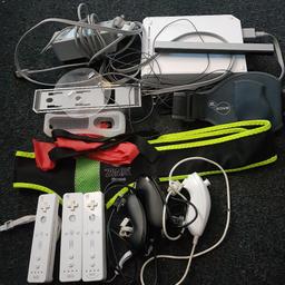 wii bundle comes with console with all wires and adaptors, sensor bar, fitness step board, 3 controllers 2 have backs missing but doesn't affect use and can get them on eBay for 3 pounds, 3 num chucks zumba belt and sports band. base for console to sit in. It comes with 15 games. It is good condition with general signs of wear which doesn't affect use. please note  wires have wear to them but still work.
