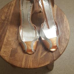 These unique heels are worn once. They are very smart and elegant. Bought in America these BCBGIRLS heels will stand out...Why not own these pair for a great occasion?..