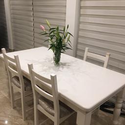 laura ashley chic white solid wood table with 4 chairs. Table in very good condition but chairs have few chips. 
170cm length. 
86cm width
£200 the lot.