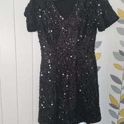 black sequin dress from warehouse.
size 10.
perfect for your coming Christmas party.
excellant condition only wore once.
paid £50