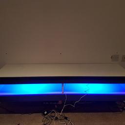 white and gloss grey wall hung tv unit with blue led lights. excellent condition, selling due to redecorating. Dimensions 150cm width and 40cm depth. collection from Wortley.
