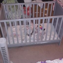 Cot for sale hasn't been used as my little girl won't go in in good condition no marks on it quite a big cot colour is grey also comes with a mattress open to offer pick up only