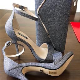 Shoes are in great condition and have only been worn once size 5 and comes with a matching brand new clutch bag with the tag still attached Can be sod separately.