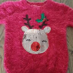 lovely Christmas jumper with goldcsequin reindeer.
size 4/5