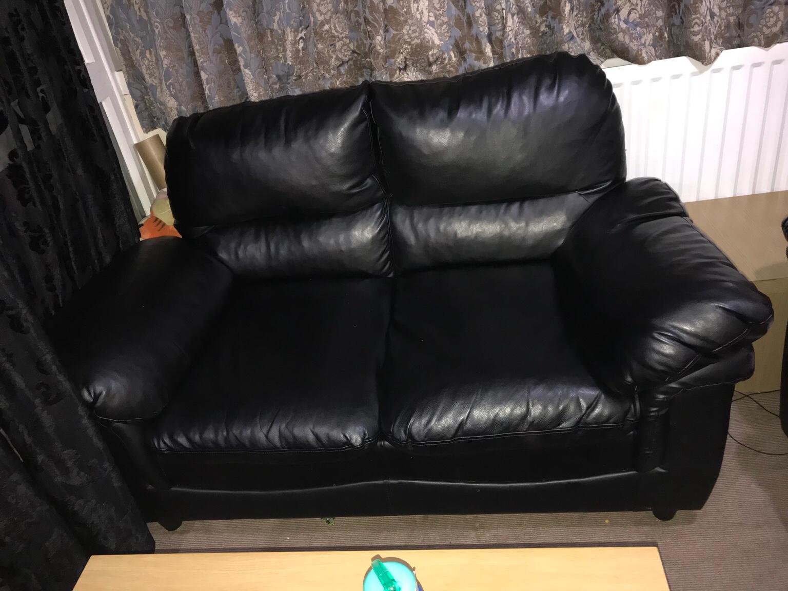 2 seater black leather sofa in KT1 Thames for £50.00 for sale Shpock
