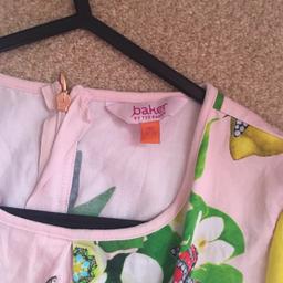 Girls ted baker shirt jump suit age 12-13 year but I would say 11-12 fit .. 
Never worn