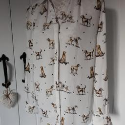 Lovely ladies blouse
printed dog pattern
New but no tag
cream back ground
fril  cuffs