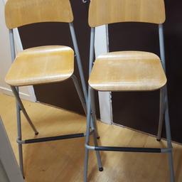 2 wooden and chrome high bar stools . fold for easy storage